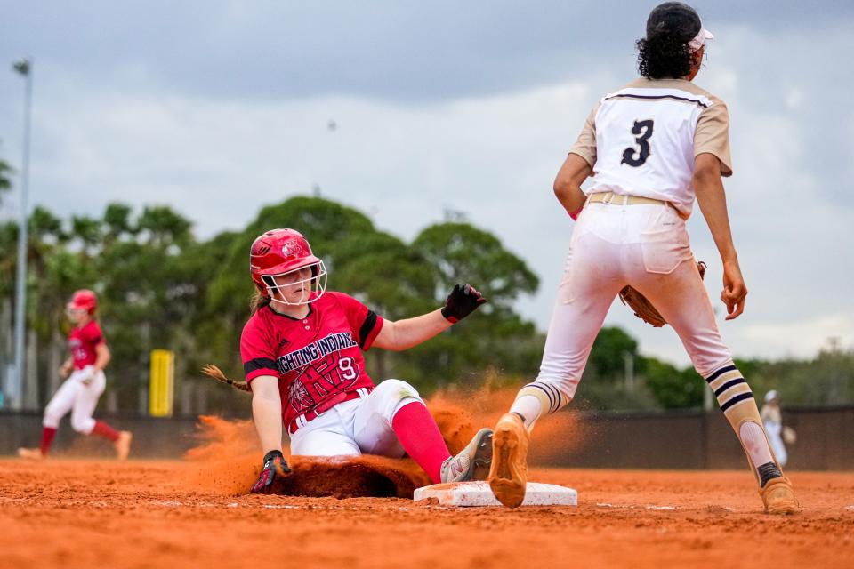 Vero Beach’s Emma Youngblood (9) slides into third against Treasure Coast during a softball game on Wednesday, March 9, 2022, in Port St. Lucie. Treasure Coast won 6-2. 