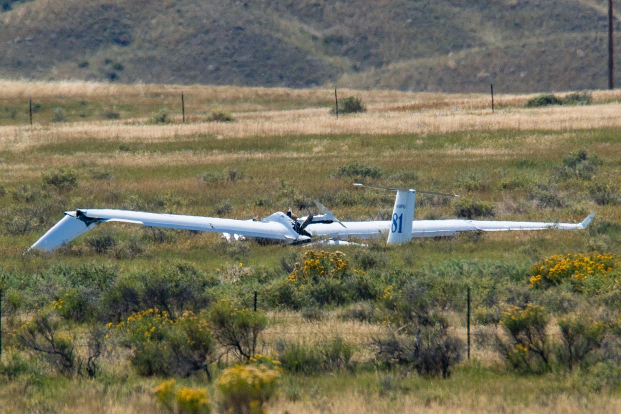 A glider aircraft sits in a field after crash landing south of the Soapstone Prairie near Wellington on Thursday.