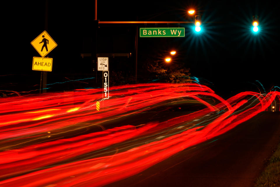 This long exposure photo shows traffic driving on Roosevelt Boulevard at Banks Way, named for Samara Banks and her three children who were struck and killed by a car in 2013, in Philadelphia, Wednesday, May 25, 2022. (AP Photo/Matt Rourke)