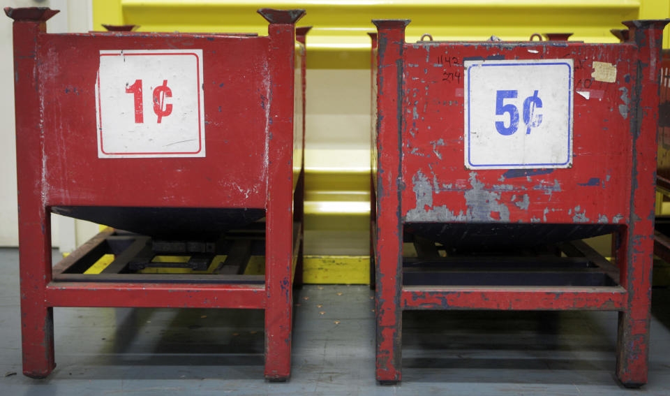 One and five cent holding bins sit at the U.S. Mint on Wednesday, June 27, 2012, in Philadelphia. The new $3.9 million exhibit opens a new tour to visitors on July 3 and it's the first upgrade in more than 40 years. (AP Photo/Brynn Anderson)