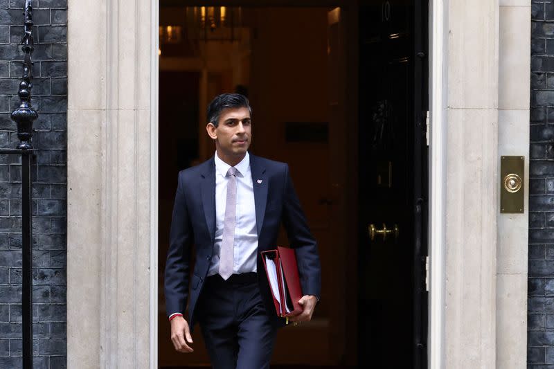 FILE PHOTO: British Prime Minister Rishi Sunak walks outside Number 10 Downing Street, in London