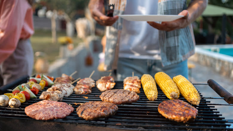 Various barbecued foods on grill