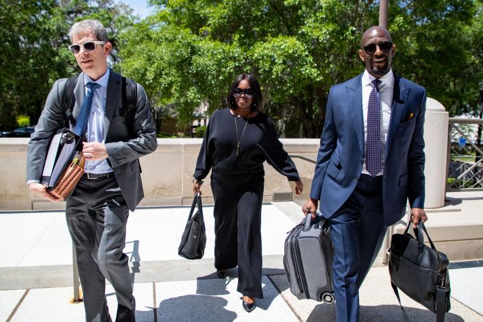 Former Tallahassee Mayor and 2018 Democratic nominee for Florida Governor, Andrew Gillum, right enters the Federal Courthouse with his defense attorney David Markus and wife, R. Jai Gillum for a pretrial hearing on Monday, April 10, 2023.