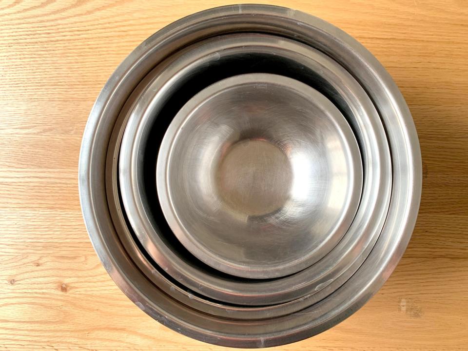 A set of graduated metal mixing bowls.