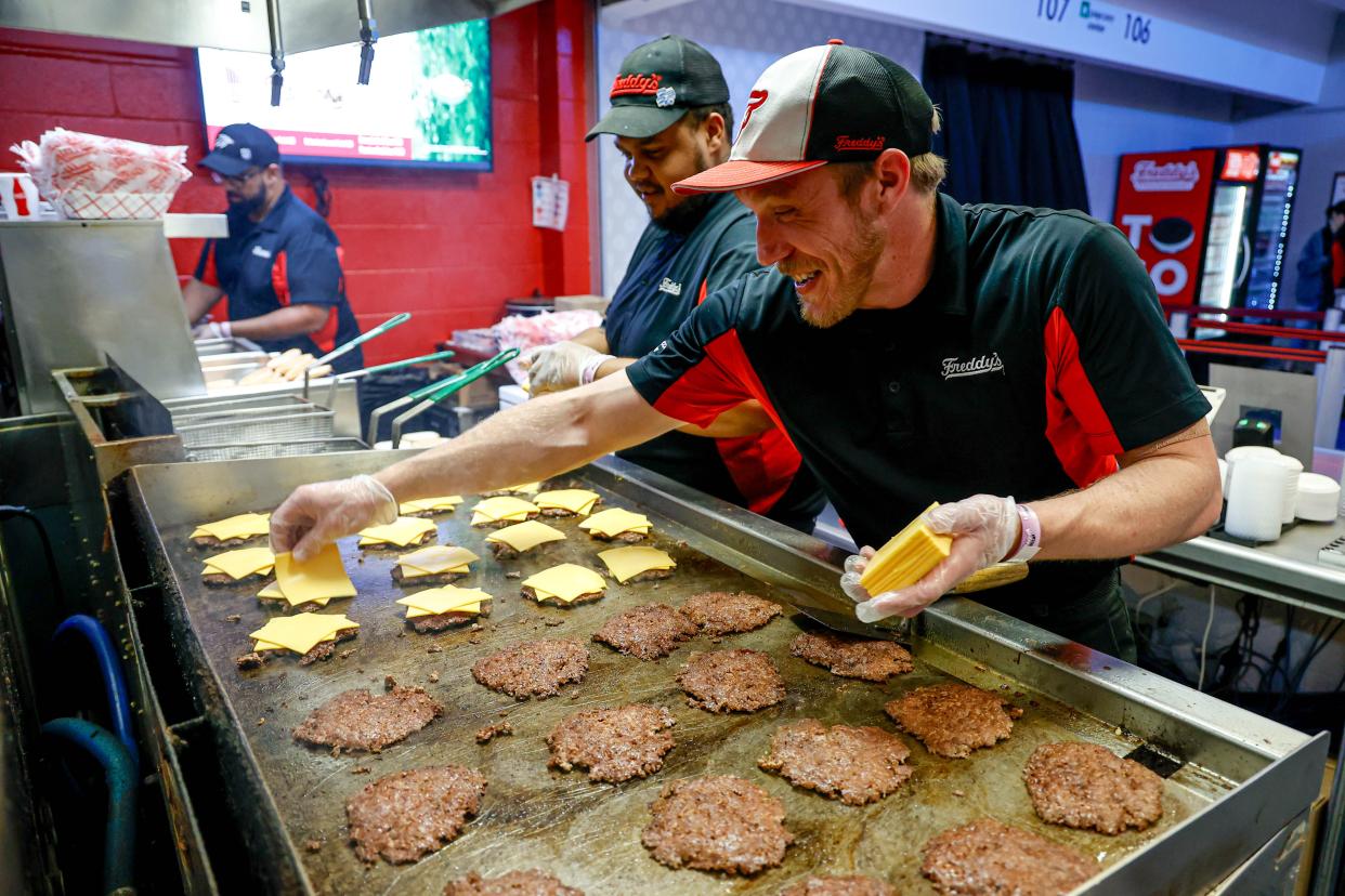 Brandon Baxter cooks burger patties before May 15 Game 5 of the Western Conference semifinals between the Oklahoma Thunder and the Dallas Mavericks at the Paycom Center in Oklahoma City. Through Go See The City's recent partnership with The Levy Restaurant Group, surplus food from the Paycom Center Arena, home of the Oklahoma City Thunder NBA franchise, has been redirected to those in need.