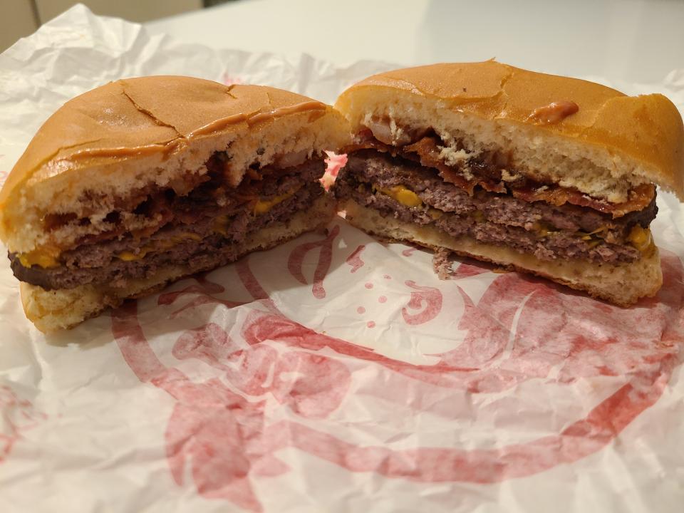 wendys bacon double stack cut open on red and white wrapper