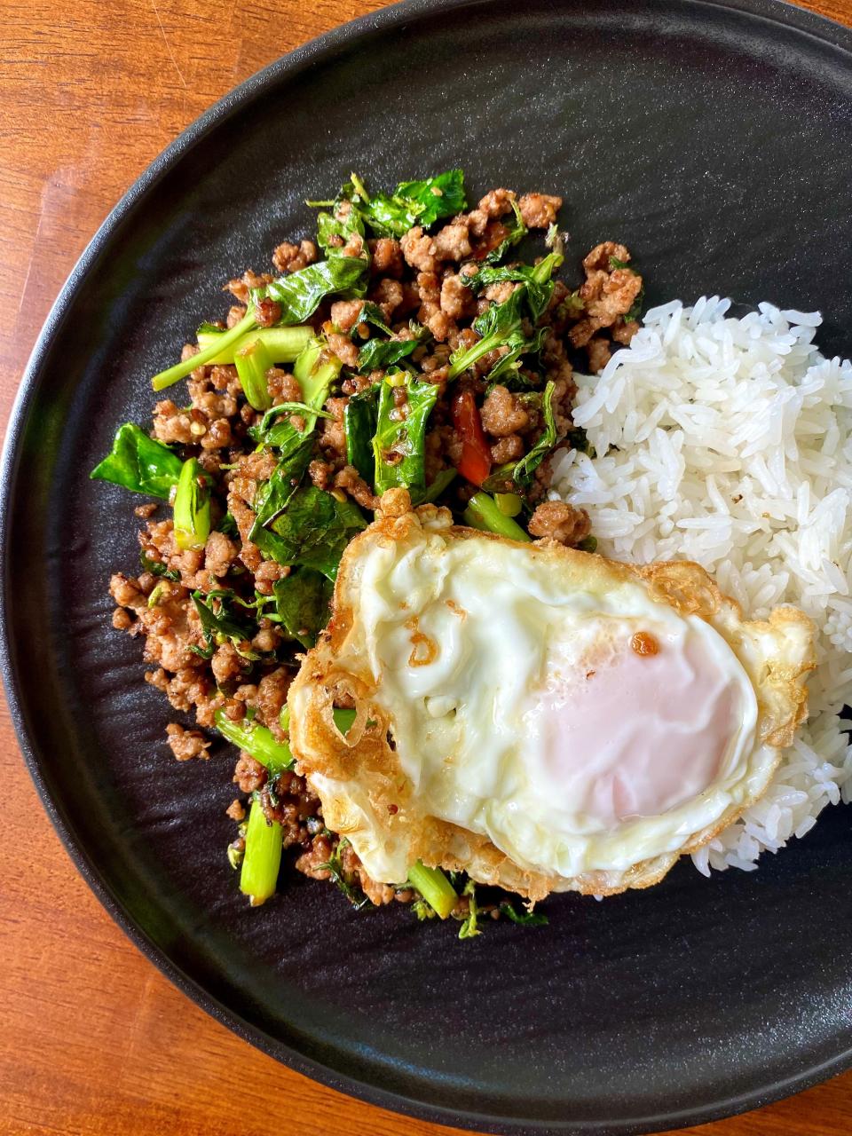 Cassia offers Pad Kra Pao, made with stir-fried holy basil with pork, a Thai fried egg and jasmine rice.