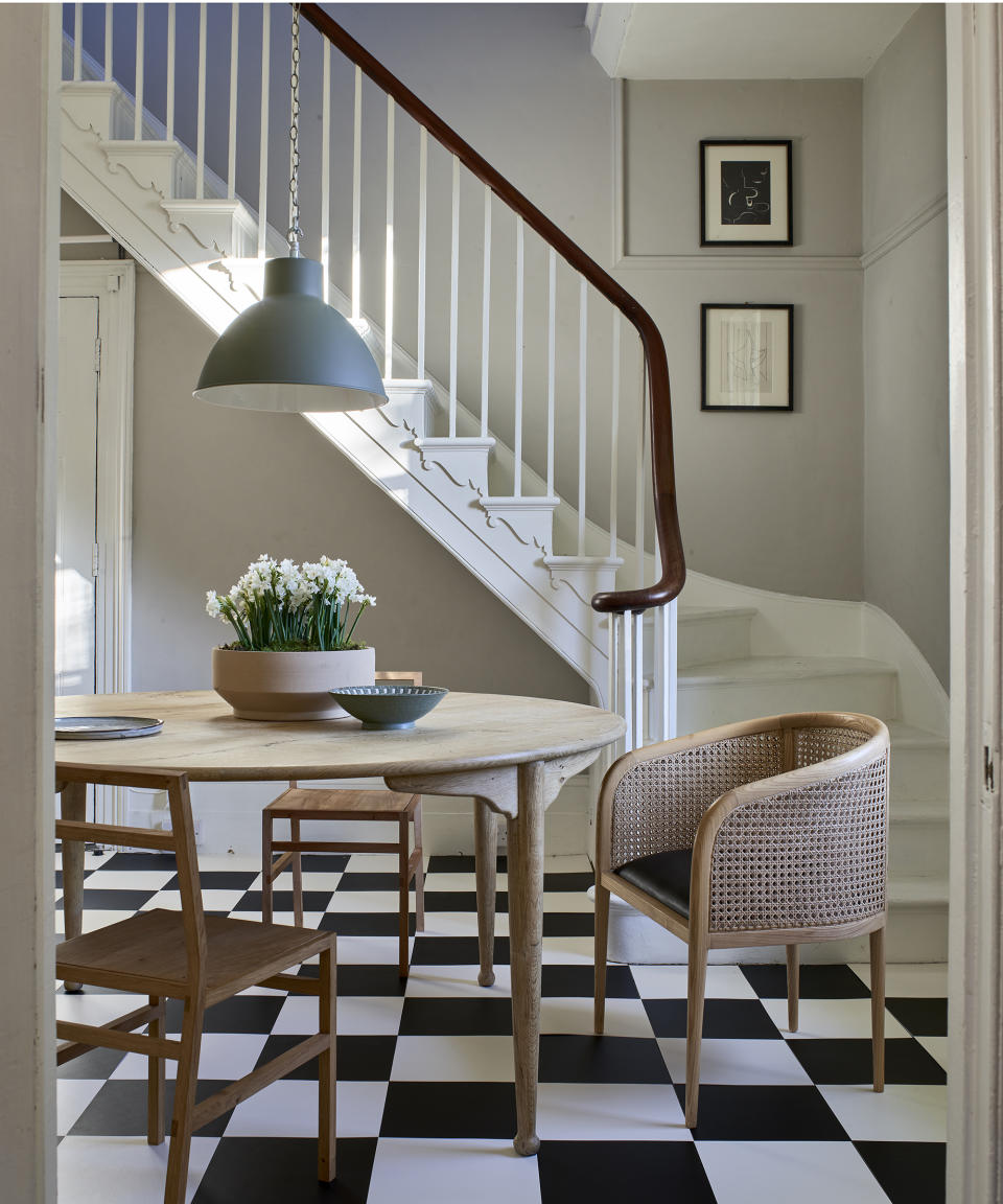 <p> A chic, black and white checkerboard flooring adds impact to a calm, neutral scheme. The monochrome palette combined with warm wooden furniture creates an inviting dining room.  </p> <p> Not only do classic black and white floor tiles add an effortlessly sophisticated feel to a room, but these vinyl tiles are a practical and fuss free option for a much used family space. This flooring choice has enduring appeal and will never go out of style.  </p>