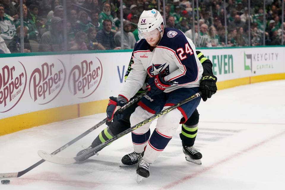 Columbus Blue Jackets right wing Mathieu Olivier (24) skates with the puck during the second period of an NHL hockey game against the Dallas Stars in Dallas, Saturday, Feb. 18, 2023. (AP Photo/LM Otero)