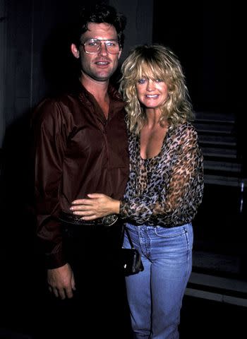 <p>Ron Galella/Ron Galella Collection via Getty Images</p> Kurt Russell and actress Goldie Hawn on July 23, 1983 leave the Carlyle Hotel.