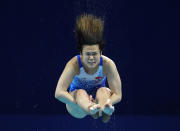 Shi Tingmao of China competes in women's diving 3m springboard preliminary at the Tokyo Aquatics Centre at the 2020 Summer Olympics, Friday, July 30, 2021, in Tokyo, Japan. (AP Photo/Dmitri Lovetsky)