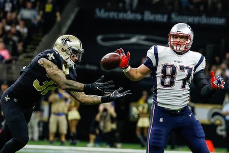 Sep 17, 2017; New Orleans, LA, USA; New Orleans Saints safety Kenny Vaccaro (32) intercepts a pass ahead of New England Patriots tight end Rob Gronkowski (87) but the play is negated by a defensive holding on safety Vonn Bell (not pictured) during the second half of a game at the Mercedes-Benz Superdome. The Patriots defeated the Saints 36-20. Mandatory Credit: Derick E. Hingle-USA TODAY Sports