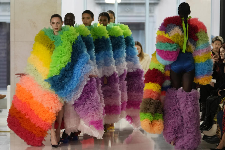 Models wear creations as part of the Tomo Koizumi women's Fall-Winter 2023-24 collection presented in Milan, Italy, Sunday, Feb. 26, 2023. (AP Photo/Luca Bruno)