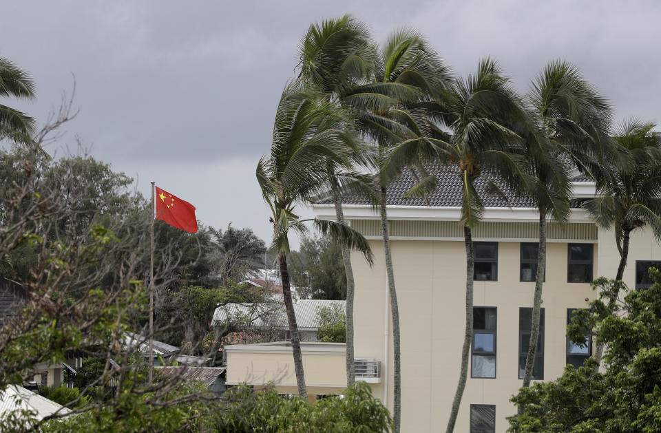 The Chinese flags flies at their embassy in Nuku'alofa, Tonga, Monday April 8, 2019. China wants 10 small Pacific nations to endorse a sweeping agreement covering everything from security to fisheries in what one leader warns is a “game-changing” bid by Beijing to wrest control of the region. (AP Photo/Mark Baker)