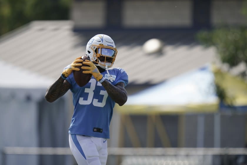 Los Angeles Chargers safety Derwin James makes a catch during an NFL football camp practice.