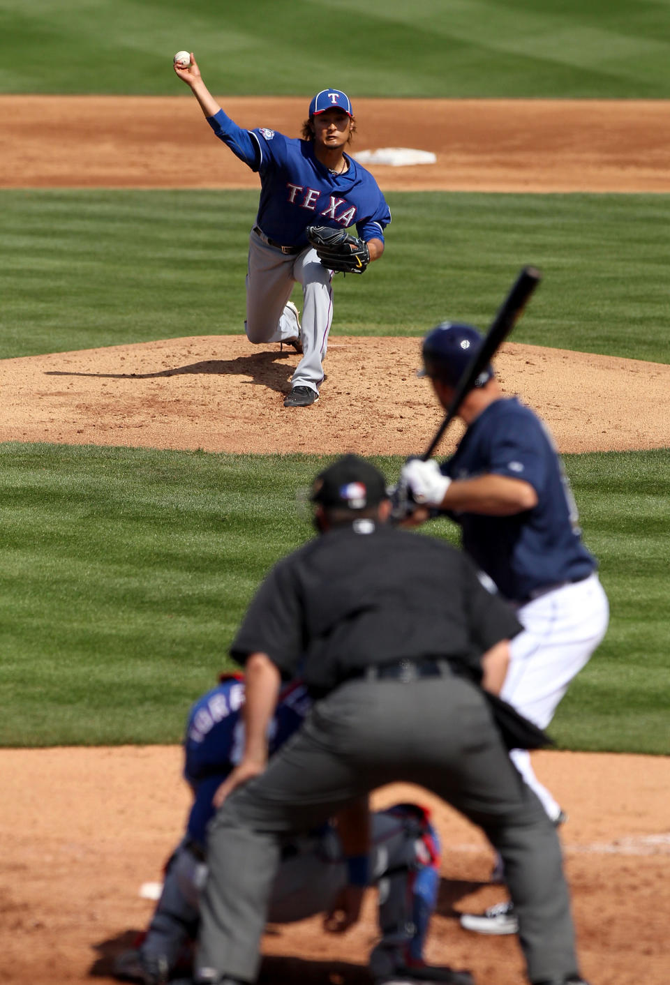PEORIA, AZ - MARCH 07: Starting pitcher Yu Darvish #11 of the Texas Rangers pitches against the San Diego Padres during the spring training game at Peoria Stadium on March 7, 2012 in Peoria, Arizona. (Photo by Christian Petersen/Getty Images)