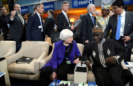 U.S. Federal Reserve Board Chairperson Janet Yellen chats with Cameroon's Finance Minister Alamine Ousmane Mey before the start of the International Monetary and Financial Committee (IMFC) meeting, as part of the IMF and World Bank's 2017 Annual Spring Meetings, in Washington, U.S., April 22, 2017. REUTERS/Mike Theiler