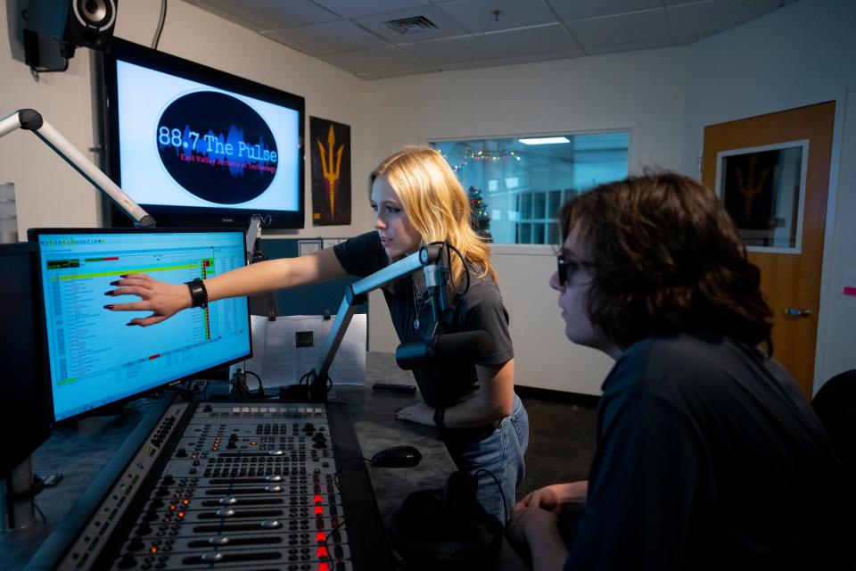 East Valley Institute of Technology students Eden Selman, 17, left, and Nick Shultz, 17, co-host a radio show on The Pulse (88.7 FM), a radio station at the school.