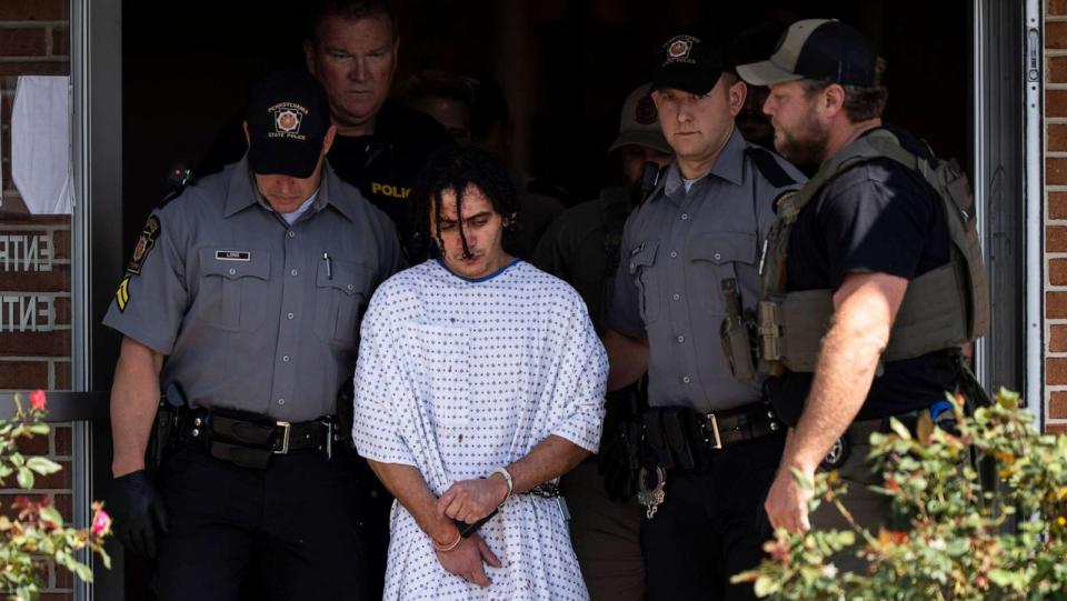 PHOTO: Law enforcement officers escort Danelo Cavalcante from a Pennsylvania State Police barracks in Avondale Pa., Sept. 13, 2023. (Matt Rourke/AP)