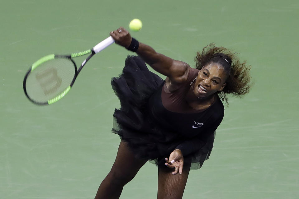 Serena Williams, of the United States, serves to Magda Linette, of Poland, during the first round of the U.S. Open tennis tournament, Monday, Aug. 27, 2018, in New York. (AP Photo/Jason DeCrow)