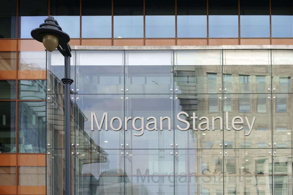 London, UK - November 29, 2014: The facade of modern bank building from Morgan Stanley with reflections and a nostalgic lantern on November 29, 2014 in London.