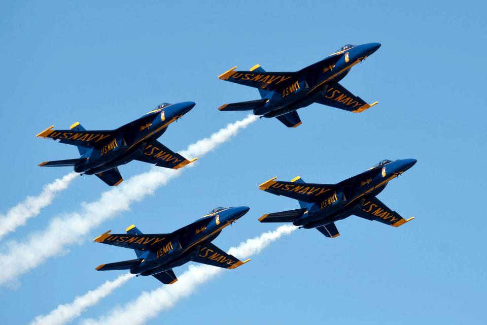 The Blue Angels pass by spectators on Pensacola Beach during their Homecoming Air Show in November 2021.