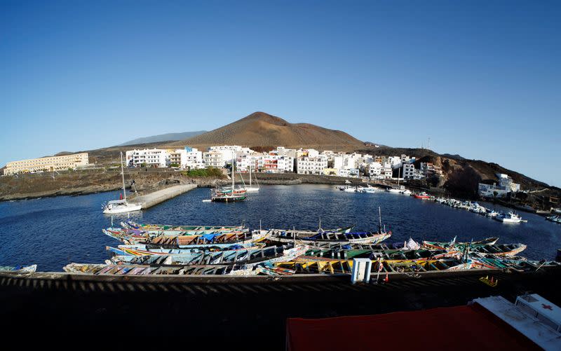 Abandoned wooden boats used by migrants in the port of La Restinga