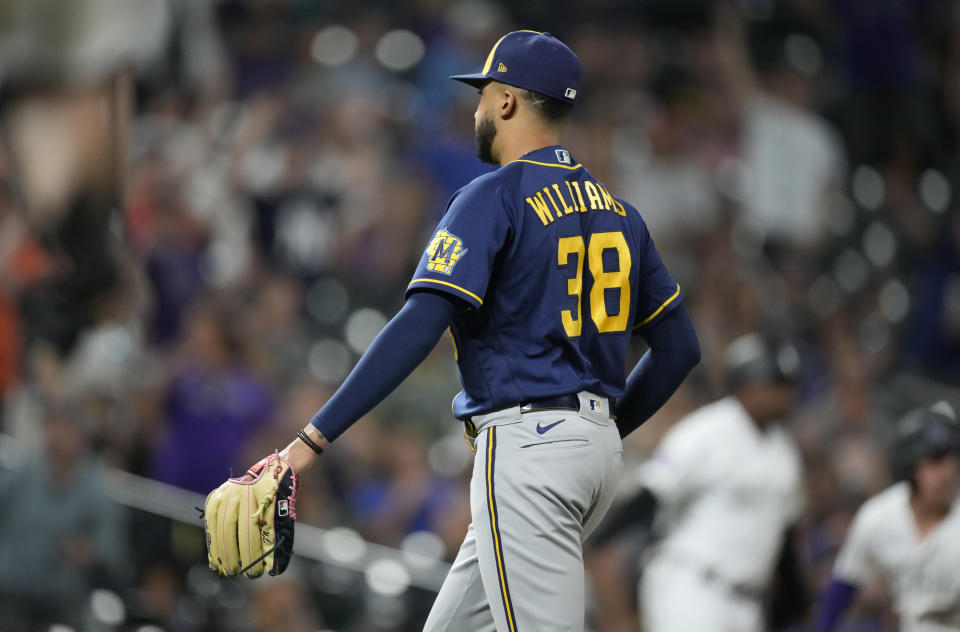 Milwaukee Brewers relief pitcher Devin Williams starts to walk off the field after Colorado Rockies' C.J. Cron hit a single to drive in the winning run in the 10th inning of a baseball game Friday, June 18, 2021, in Denver. The Rockies won 6-5. (AP Photo/David Zalubowski)