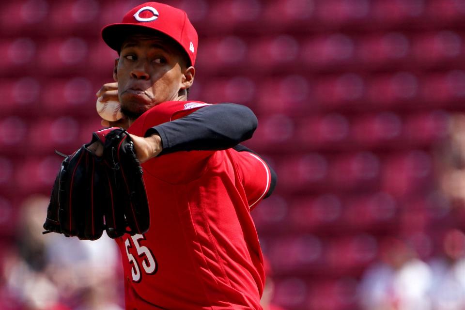 Cincinnati Reds relief pitcher Dauri Moreta (55) delivers in the ninth inning of a baseball game against the Milwaukee Brewers, Wednesday, May 11, 2022, at Great American Ball Park in Cincinnati. The Cincinnati Reds won, 14-11.