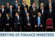 Germany's Finance Minister Olaf Scholz (C, bottom) sits alongside other finance ministers and central banks governors as they gather for the official photo at the G20 Meeting of Finance Ministers in Buenos Aires, Argentina, March 19, 2018. REUTERS/Marcos Brindicci