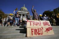 People celebrate outside the Pennsylvania State Capitol in Harrisburg, Pa., after Democrat Joe Biden defeated President Donald Trump to become 46th president of the United States. (AP Photo/Julio Cortez)