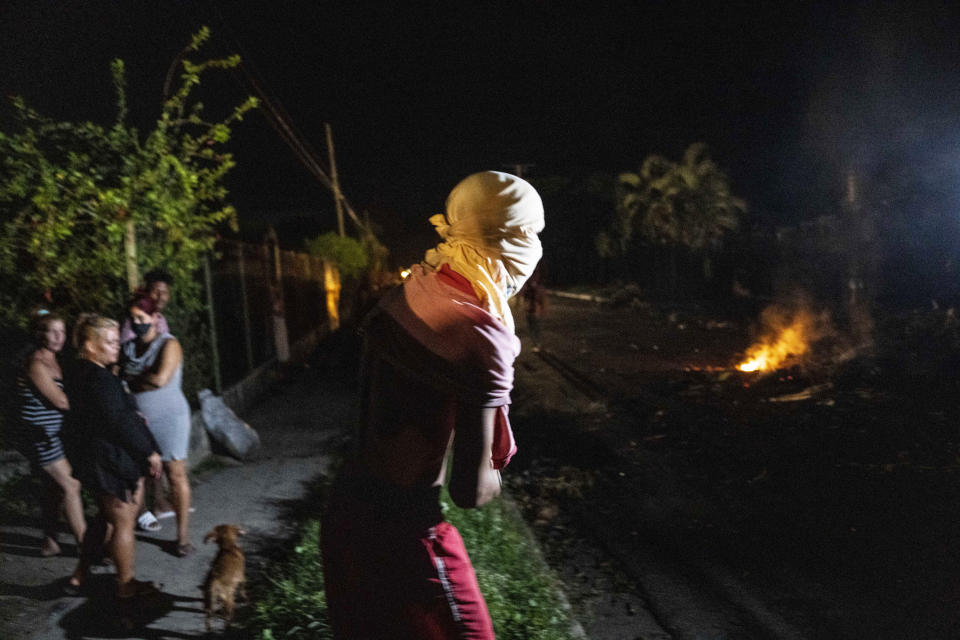 People protest asking for the restoration of the electrical service that collapsed last Tuesday due to the devastation of Hurricane Ian in Bacuranao, Cuba, Friday, Sept. 30, 2022. (AP Photo/Ramon Espinosa)