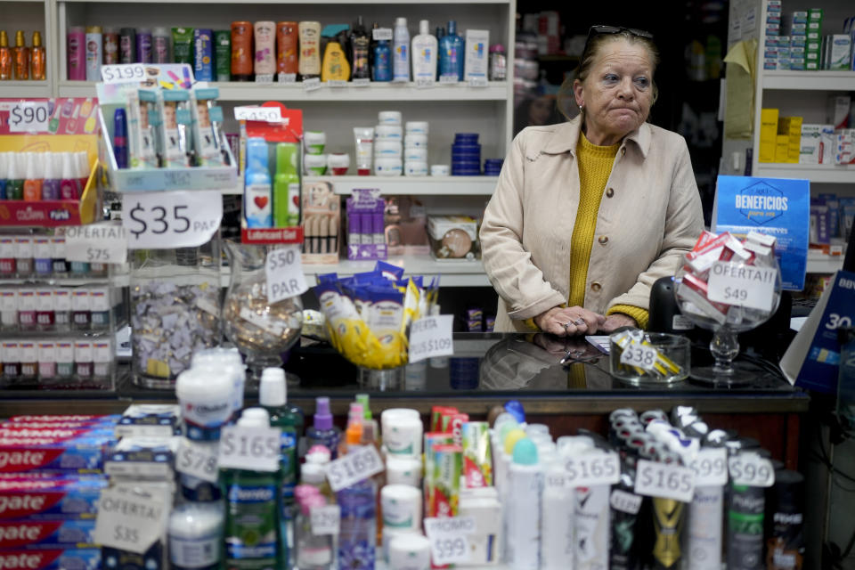 Uruguayan shop worker Alicia Nedor gives an interview at her shop where she says sales are down in Fray Bentos, Uruguay, Friday, June 30, 2023. Uruguayan President Luis Lacalle Pou said in May that his government has applied measures to combat the imbalance created by the exchange rate in neighboring Argentina, like tax breaks for Uruguayan businesses and a 5-kilogram limit on what Uruguayans returning from Argentina can bring with them. (AP Photo/Natacha Pisarenko)