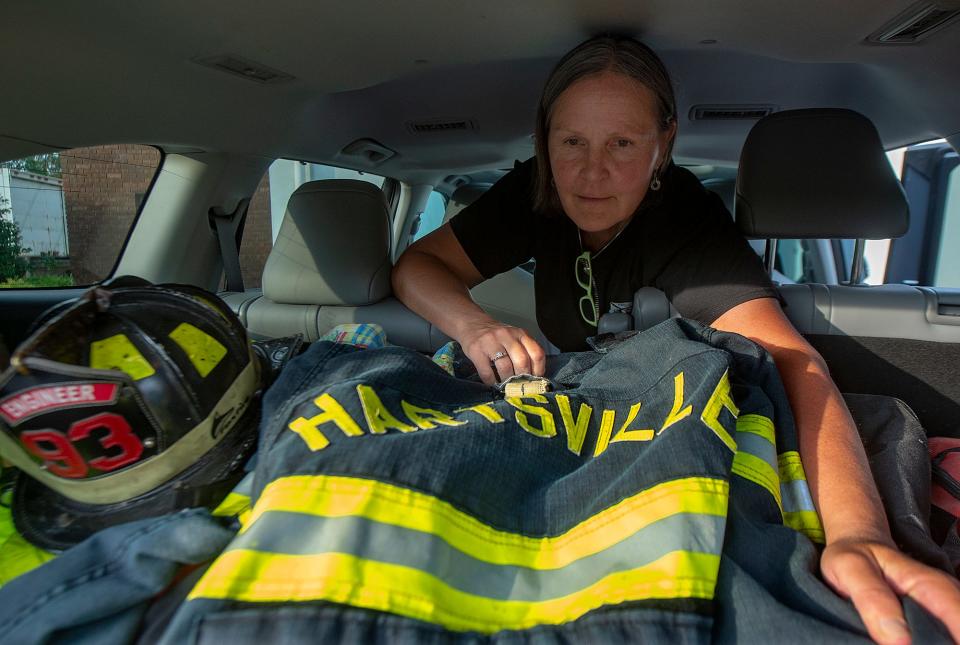 While the flooring imside the firehouse is being refinished, Lynn Kirkner, 57, a firefighter with the Hartsville Fire Company, in Warminster, on Wednesday, July 27, 2022, keeps her gear in the back of her suv.