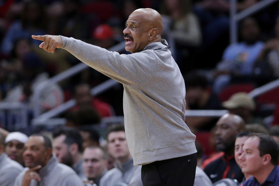 Houston Rockets assistant coach John Lucas, taking head coaching duties for Stephen Silas, yells out plays during the second half of an NBA basketball game against the Milwaukee Bucks, Sunday, Dec. 11, 2022, in Houston. (AP Photo/Michael Wyke)