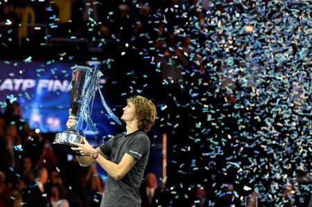 Tennis - ATP Finals - The O2, London, Britain - November 18, 2018 Germany's Alexander Zverev celebrates with the trophy after winning the final against Serbia's Novak Djokovic Action Images via Reuters/Tony O'Brien