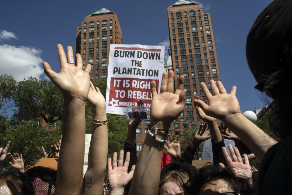 Protesters raise their hands in a solidarity rally for George Floyd, Saturday, May 30, 2020, in New York. Demonstrators took to the streets of New York City to protest the death of Floyd, a black man who was killed in police custody in Minneapolis on May 25. (AP Photo/Wong Maye-E)