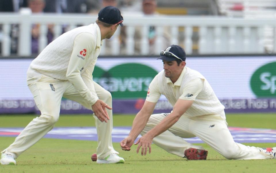 Alastair Cook (R) reacts to dropping a catch for England on Friday  - Getty Images Europe