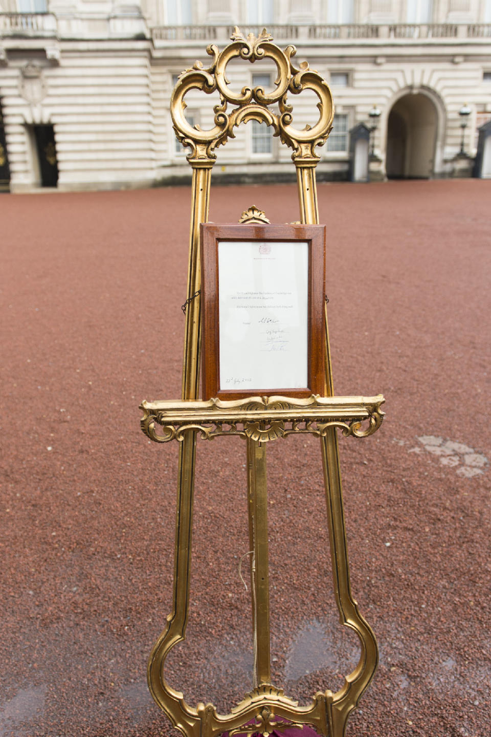 Royal births are announced with a gold easel outside Buckingham Palace