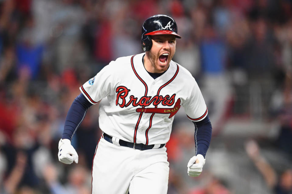 Freddie Freeman gives in to his emotions after homering in Game 3 of the NLDS. (Getty)
