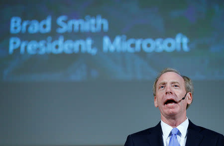 FILE PHOTO: Brad Smith, President and Chief Legal Officer of Microsoft takes part in a panel discussion "Cyber, big data and new technologies. Current Internet Governance Challenges: What's Next ?" at the United Nations in Geneva, Switzerland November 9, 2017. REUTERS/Denis Balibouse/File Photo