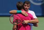 Aug 18, 2016; Mason, OH, USA; Grigor Dimitrov (BUL) meets with Stan Wawrinka (SUI) after defeating him on day six during the Western and Southern tennis tournament at Linder Family Tennis Center. Mandatory Credit: Aaron Doster-USA TODAY Sports