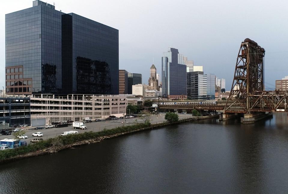 Drone image of the New Jersey Transit headquarters seen from the Passaic River as a passenger train leaves Newark Penn Station on Tuesday, Sept. 28, 2021.