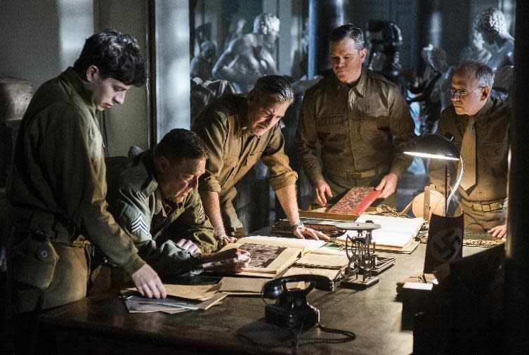 This image released by Columbia Pictures shows from left, Sam Epstein, John Goodman, George Clooney, Matt Damon and Bob Balaban in a scene from "The Monuments Men." (AP Photo/Sony, Columbia Pictures, Claudette Barius)