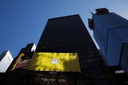 A billboard displays the logo of Snapchat above Times Square in New York March 12, 2015. REUTERS/Lucas Jackson/Files