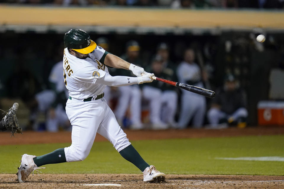 Oakland Athletics' Shea Langeliers hits a solo home run against the New York Yankees during the sixth inning of a baseball game in Oakland, Calif., Thursday, Aug. 25, 2022. (AP Photo/Godofredo A. Vásquez)