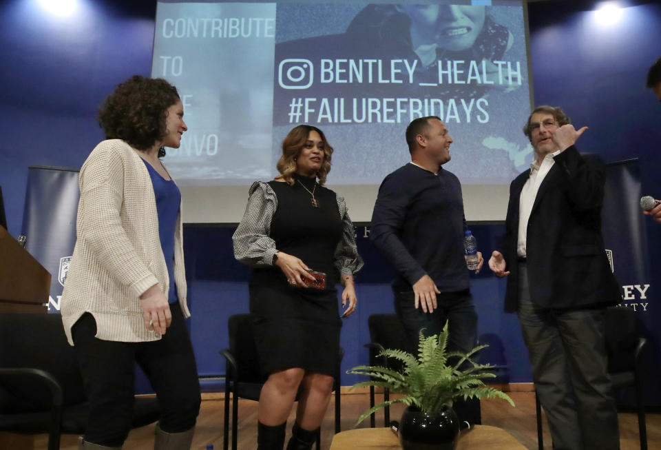 In this March 5, 2019 photo, panel members, from left, Angela Giordano, Natalie Baucum, Mike Duggan and Fred Ledley participate in an event at Bentley University, in Waltham, Mass., where professors and alumni shared some of their worst setbacks to illustrate that even successful people sometimes fail. A growing number of U.S. colleges are trying to "normalize" failure for a generation of students who increasingly struggle with stress, anxiety and the ability to bounce back from adversity. (AP Photo/Elise Amendola)