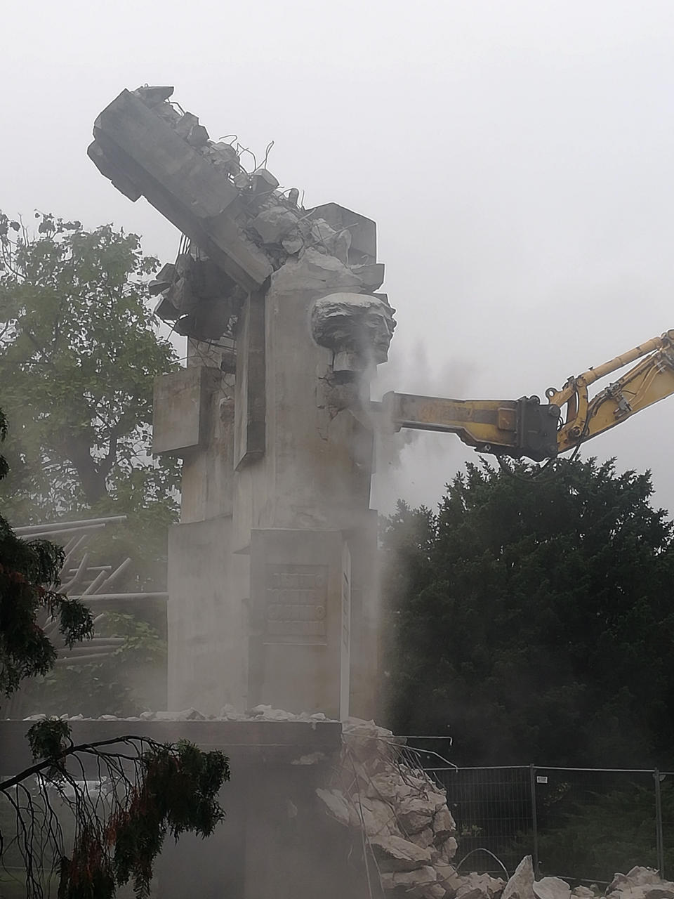 Workers begin to demolish a Soviet-era monument to the Red Army, in Brzeg, Poland, on Wednesday Aug. 24, 2022. Poland on Wednesday began demolishing a memorial to the Soviet Red Army soldiers, an unwanted reminder of the power Moscow once held over Poland whose presence became even more objectionable after Russia's invasion of Ukraine. (IPN Wroclaw via AP)