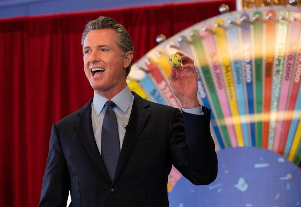Governor Gavin Newsom holds a lottery ball at the California Lottery Headquarters on Friday, June 4, 2021, in Sacramento, while drawing numbers for California’s new $116.5 million Vax for the Win program – the largest vaccine incentive program in the nation.