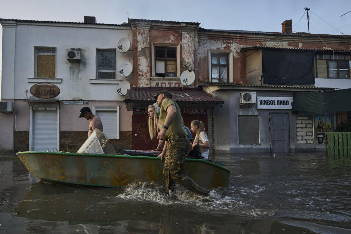 Rescue workers with residents of Kherson, Ukraine